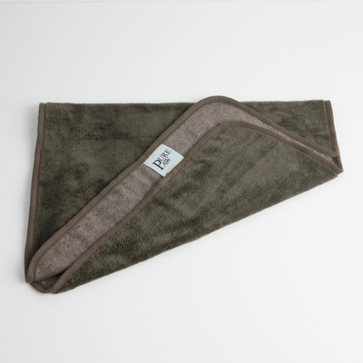 PurePaw bamboo dog towel in moss, folded with its woven label