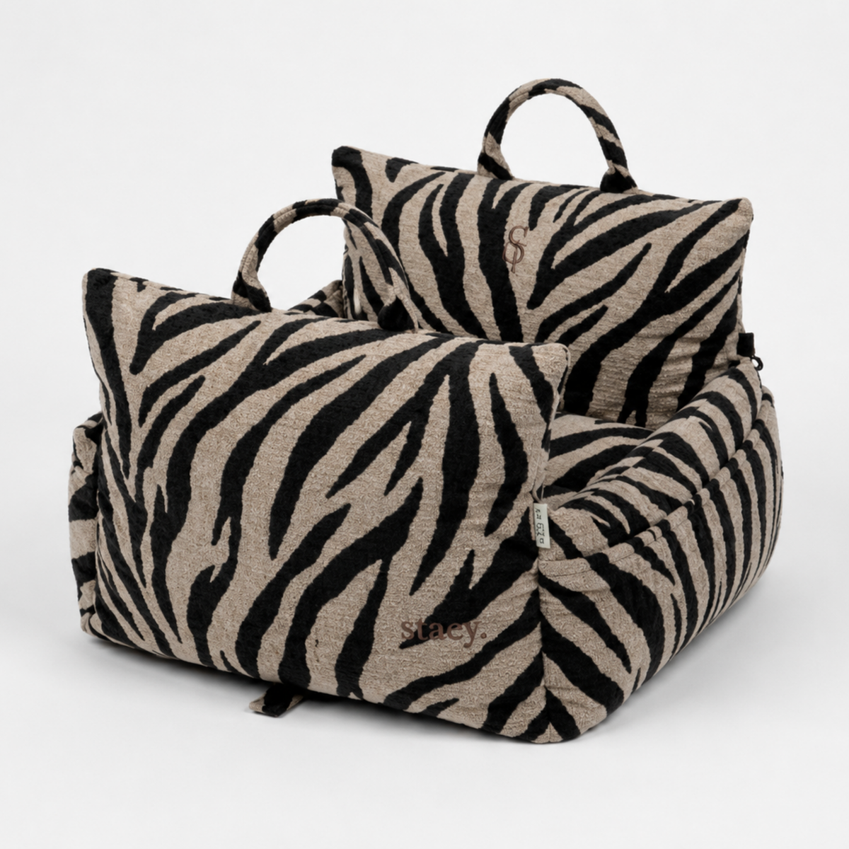 Lara dog car seat in zebra print with padded bolsters and carry handles