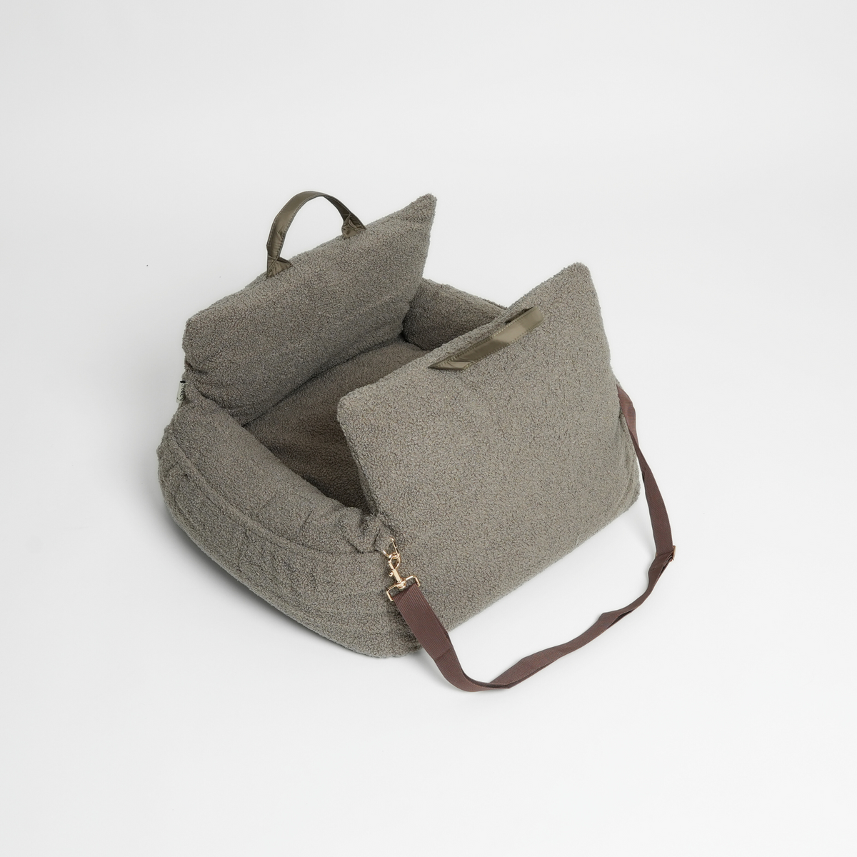 Moss green Staey dog car seat with its shoulder strap